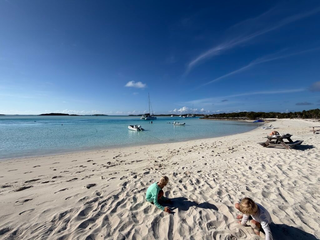 Playing on the beach in Warderick Wells