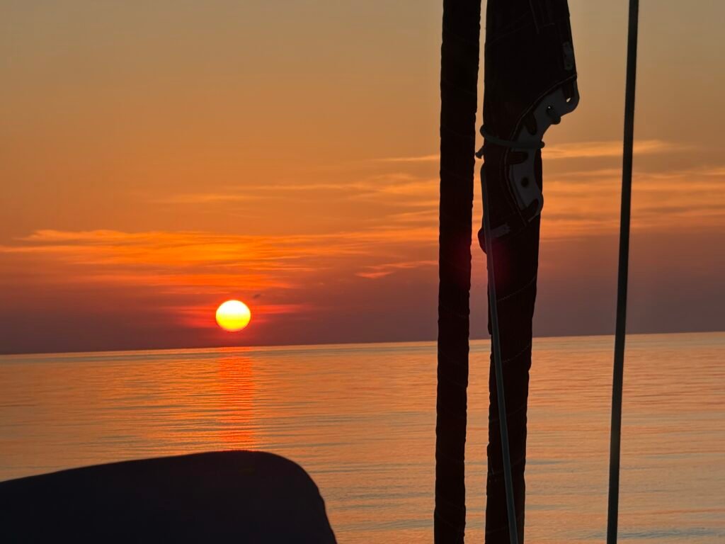 The sun setting on our first day of passage back to the US